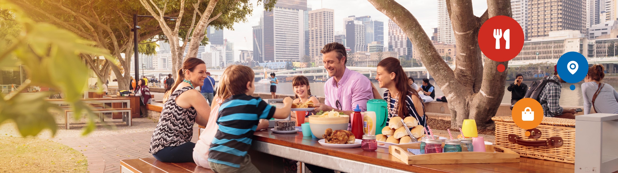 Banner image showing residents enjoying a picnic lunch beside the Brisbane River.
